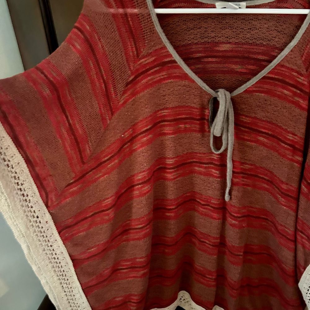 This Jule’ XL shawl type sweater is very becoming and keeps you warm in a breeze